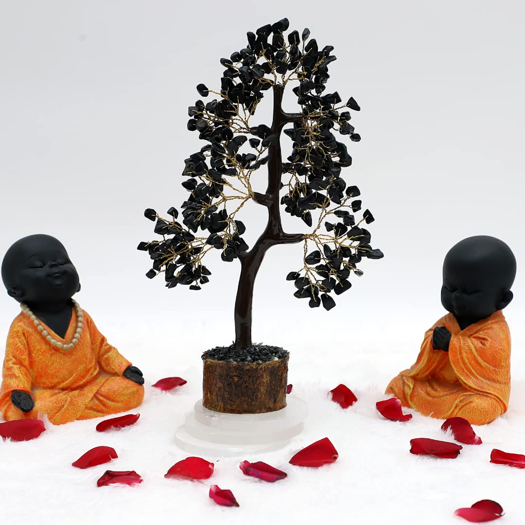 Black Crystal Tree decor displayed with serene figurines and rose petals for a calming ambiance