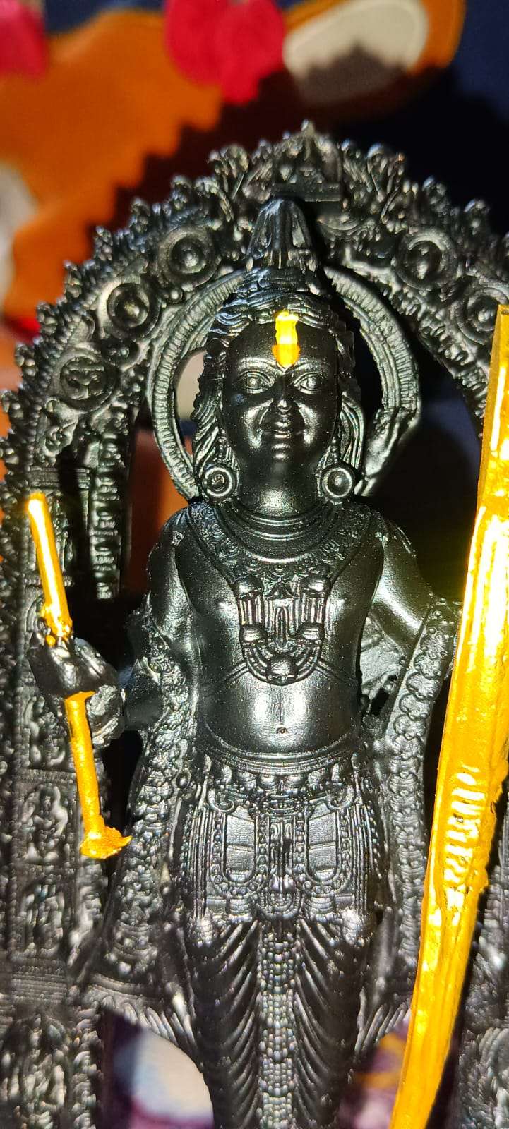 Lord Ram idol home decor in intricate black design with yellow accents and decorative elements