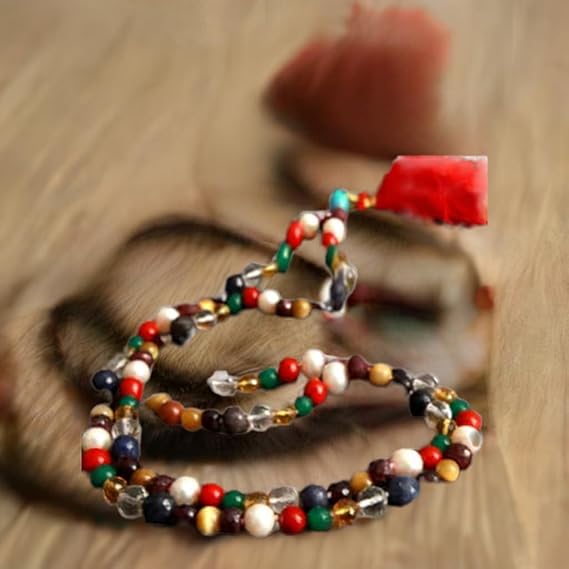 Colorful Navratan Necklace for Inner Peace adorned with various gemstones and beads on a textured background