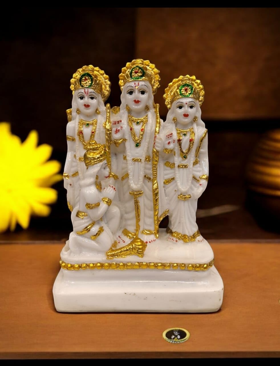 Ram Laxman Sita Hanuman idol in white and gold, symbolizing devotion and spirituality