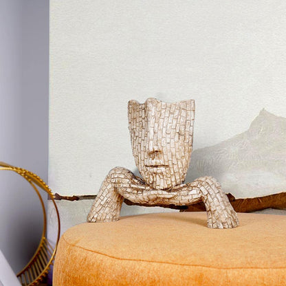 Artistic face planter sculpture in a unique design, perfect for home decor and plant lovers
