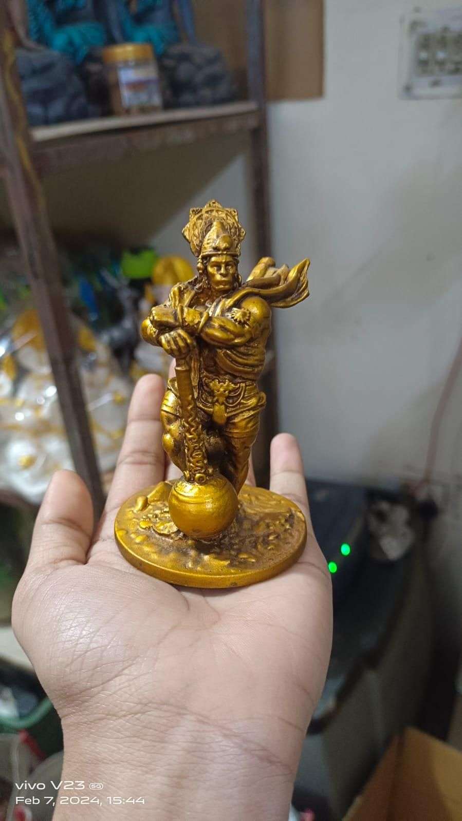 Car dashboard Hanuman statue in gold finish, perfect for adding spiritual decor to your vehicle