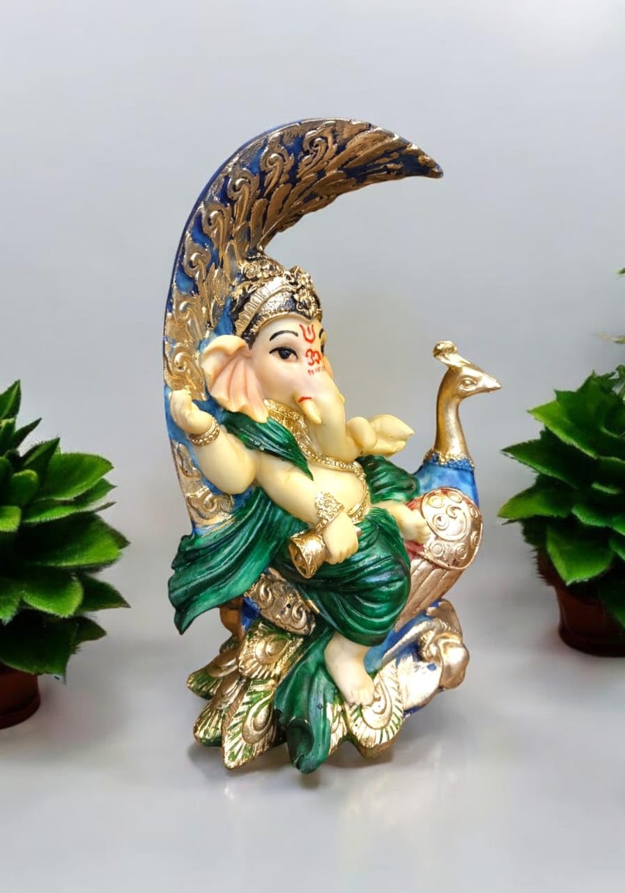 Decorative Ganesha idol with peacock in vibrant colors, showcasing intricate details and craftsmanship