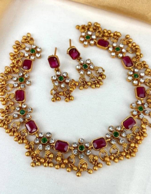 Elegant designer choker jewelry for weddings with ruby accents and intricate gold detailing
